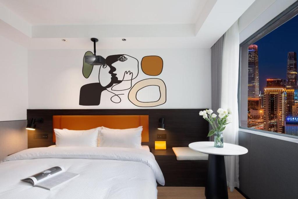 Postel nebo postele na pokoji v ubytování Mcsrh Hotel-Shenzhen Liutang