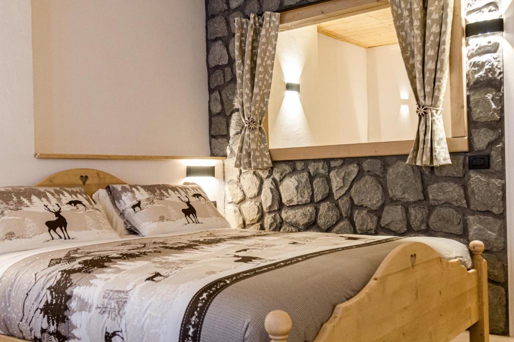 Postel nebo postele na pokoji v ubytování Hotel Al Foiron
