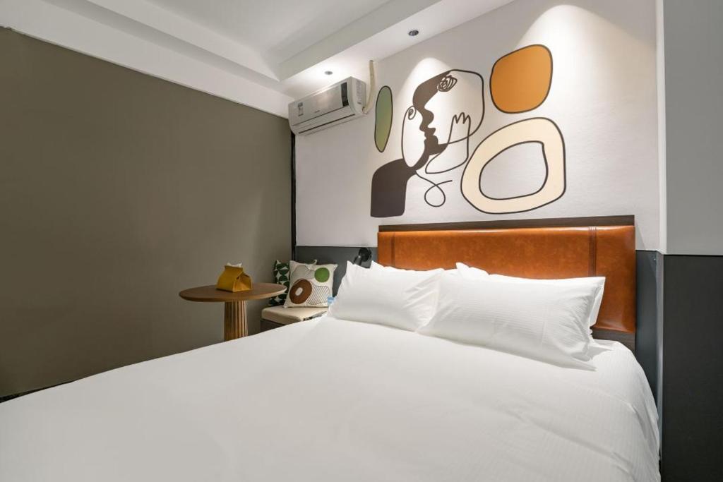Postel nebo postele na pokoji v ubytování Mcsrh Hotel-Shenzhen Liutang