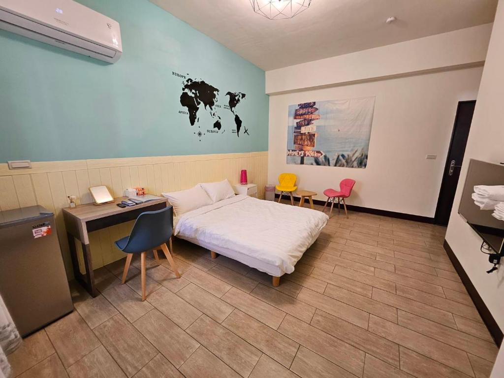 Postel nebo postele na pokoji v ubytování 澎湖紙飛機民宿Paper Jet B&B
