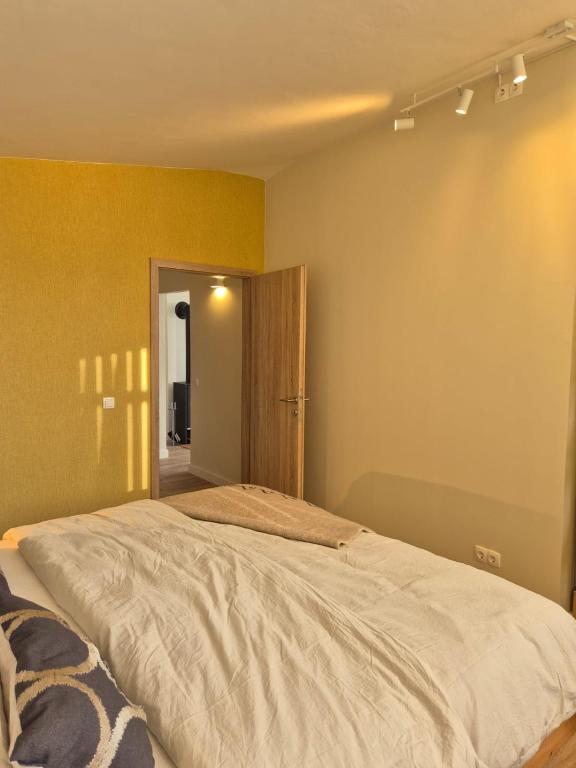 Postel nebo postele na pokoji v ubytování Sonnefeld Lodge
