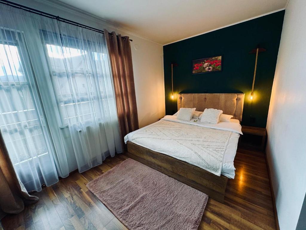 Postel nebo postele na pokoji v ubytování Casa Traian