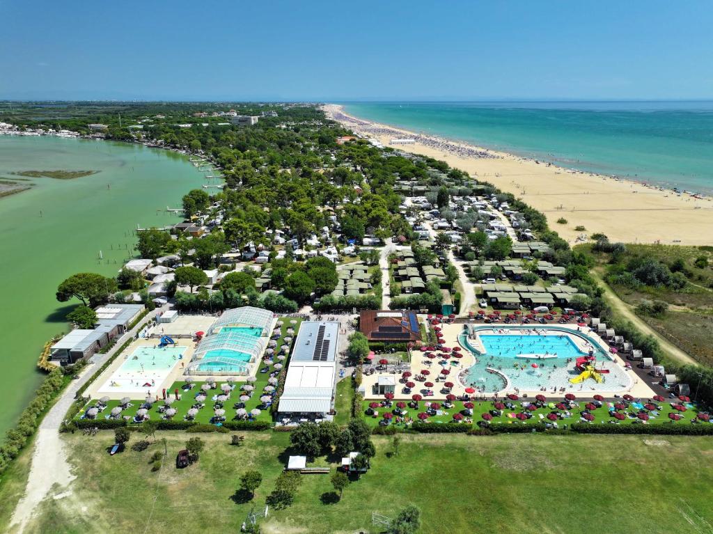 an aerial view of the pool at the beach at Camping Village Capalonga in Bibione