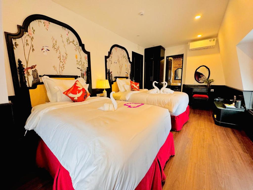 Giường trong phòng chung tại The ORCHID PREMIUM Hotel