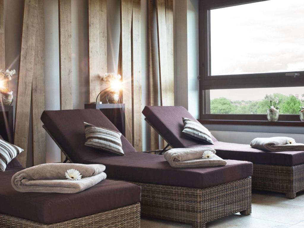 Posezení v ubytování Mövenpick Hotel Münster am Aasee