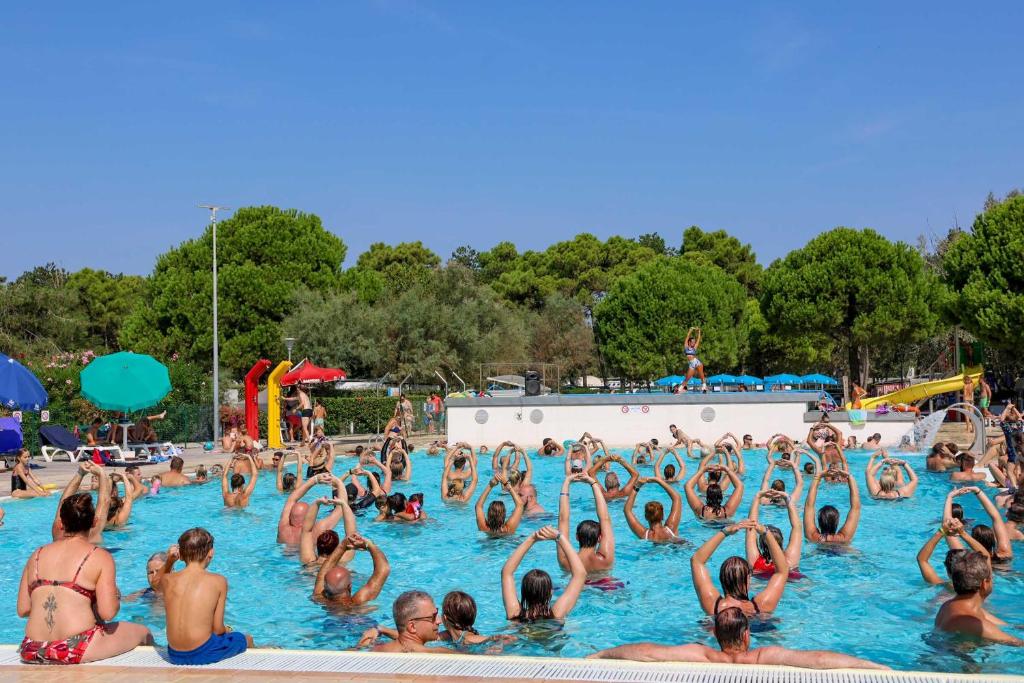 a large group of people in a swimming pool at Camping Lido in Bibione