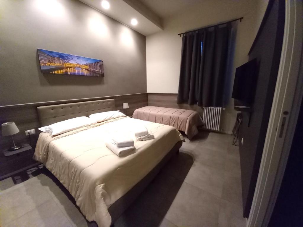 Postel nebo postele na pokoji v ubytování La Corte di Firenze Bed and Breakfast