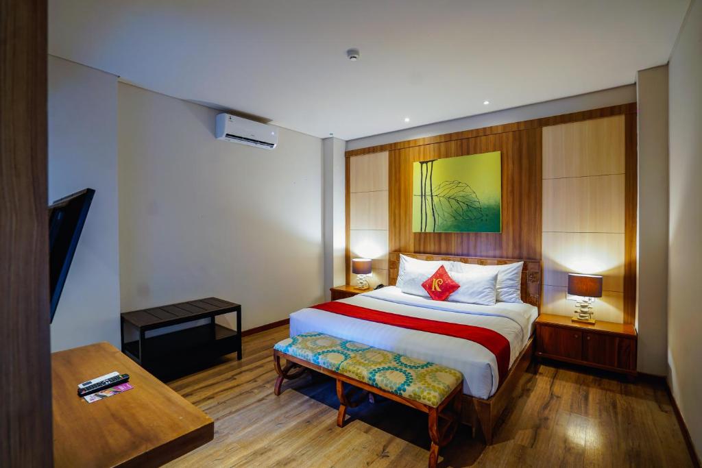 Postel nebo postele na pokoji v ubytování The Kirana Canggu Hotel