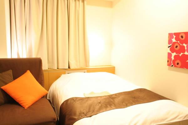 Postel nebo postele na pokoji v ubytování Hotel Estacion Hikone