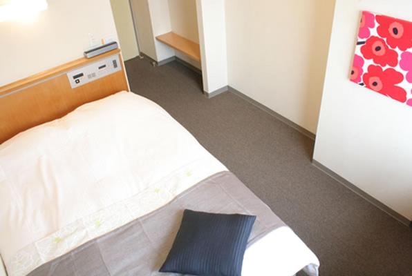 Postel nebo postele na pokoji v ubytování Hotel Estacion Hikone