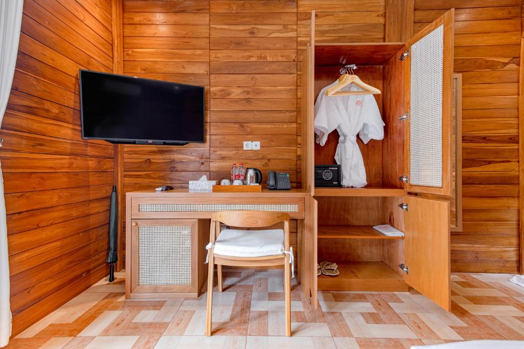 TV a/nebo společenská místnost v ubytování Anartha Resort Jimbaran By Kubu GWK
