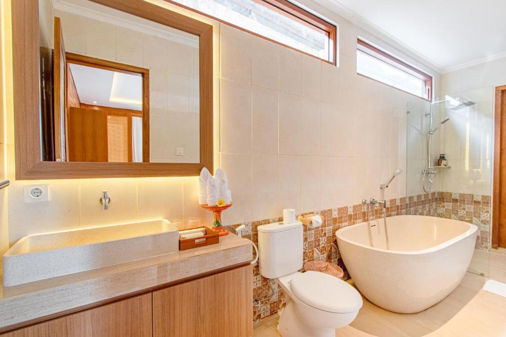 Koupelna v ubytování Anartha Resort Jimbaran By Kubu GWK