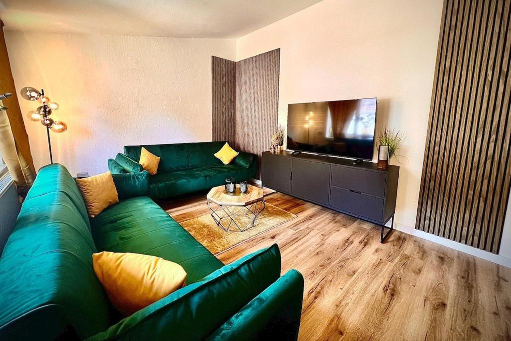 Et tv og/eller underholdning på Elegante Dreizimmer-Wohnung