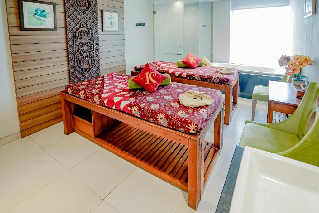 Postel nebo postele na pokoji v ubytování The Kirana Canggu Hotel
