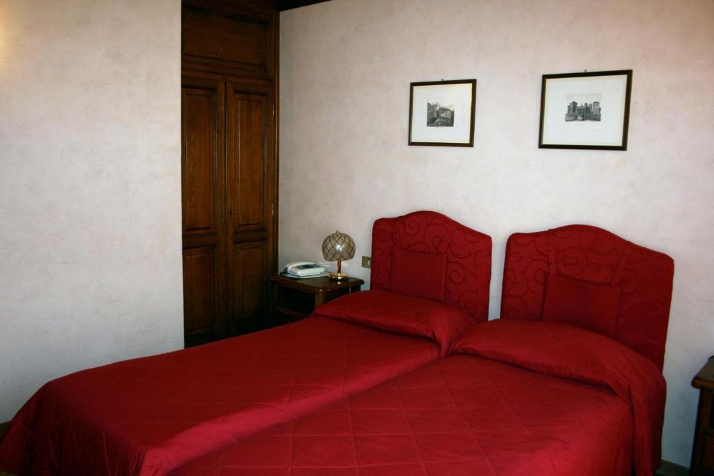 Кровать или кровати в номере Hotel Panoramique