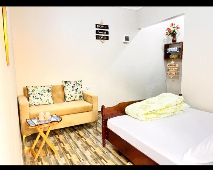 Ένα ή περισσότερα κρεβάτια σε δωμάτιο στο Divine Homestay Arusha