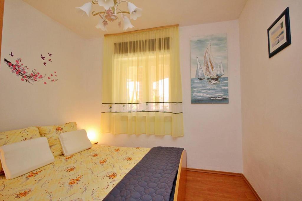 Posteľ alebo postele v izbe v ubytovaní Apartment Renata