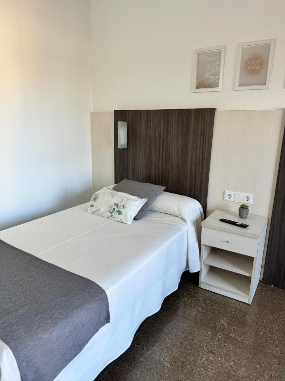 Postel nebo postele na pokoji v ubytování HOTEL MORELL