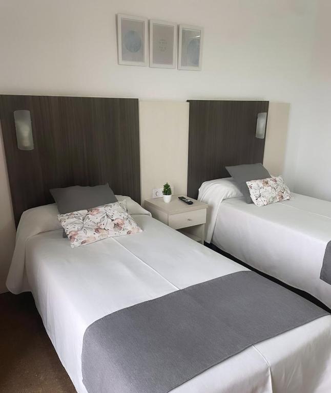 Postel nebo postele na pokoji v ubytování HOTEL MORELL
