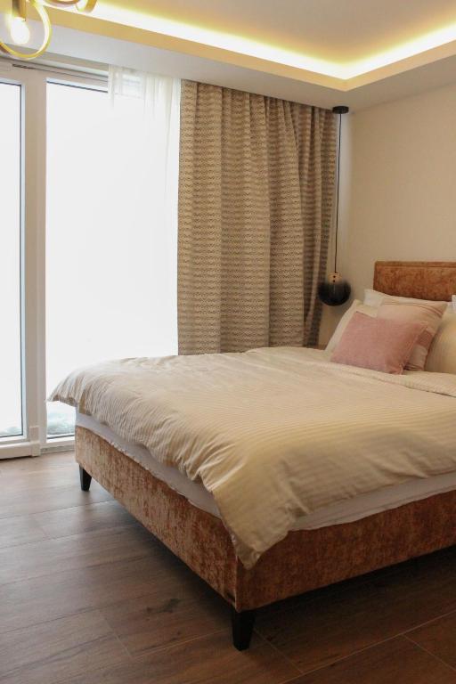 Postel nebo postele na pokoji v ubytování Tarvil Apartmani - Zaovine