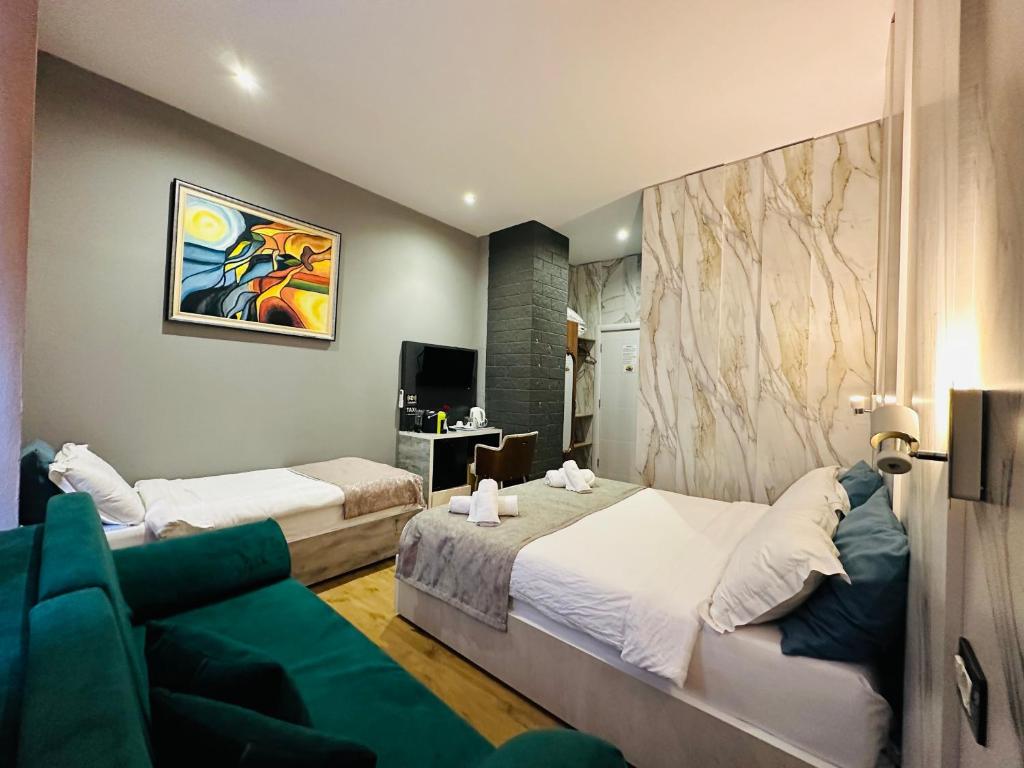 Postel nebo postele na pokoji v ubytování Colombia Apartments&Rooms