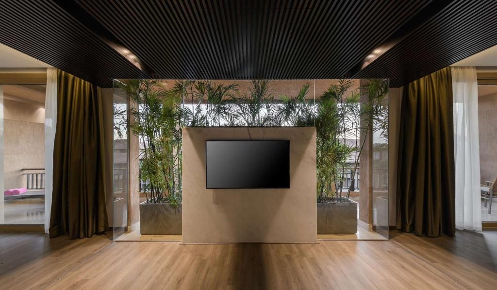 TV a/nebo společenská místnost v ubytování Dusit Thani LakeView Cairo
