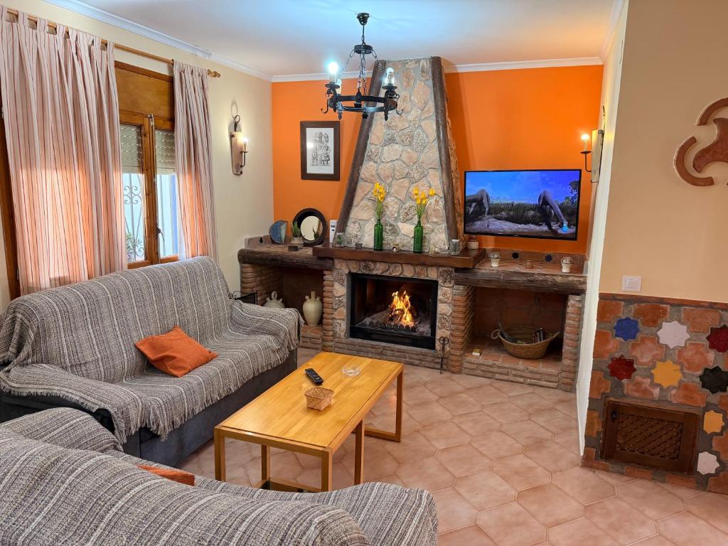 Et opholdsområde på Casa Rural NIEVES piscina privada