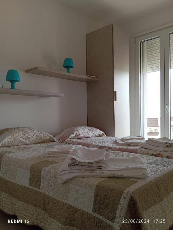 Postel nebo postele na pokoji v ubytování Casa mare Torre Pali Salento