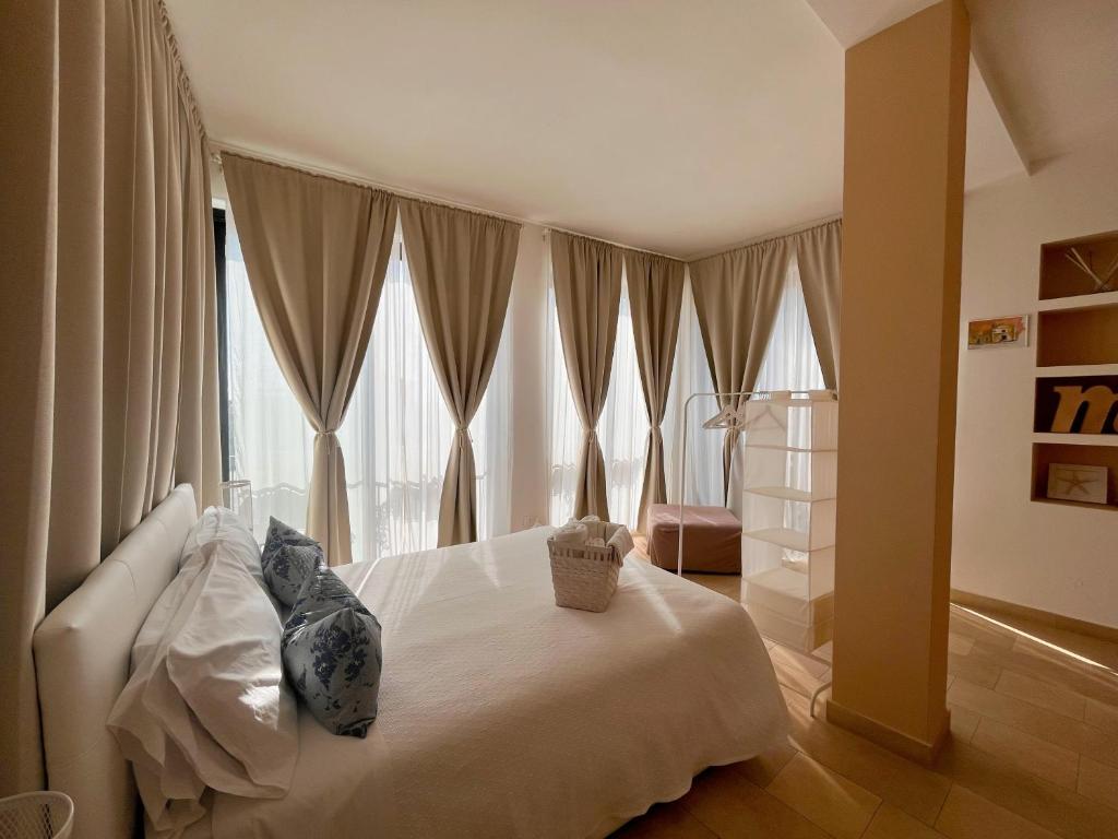 Postel nebo postele na pokoji v ubytování Regina Margherita B&B