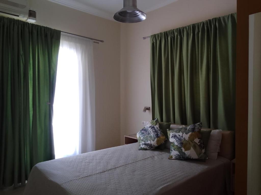 A bed or beds in a room at Eleonas Holiday Home Apartment
