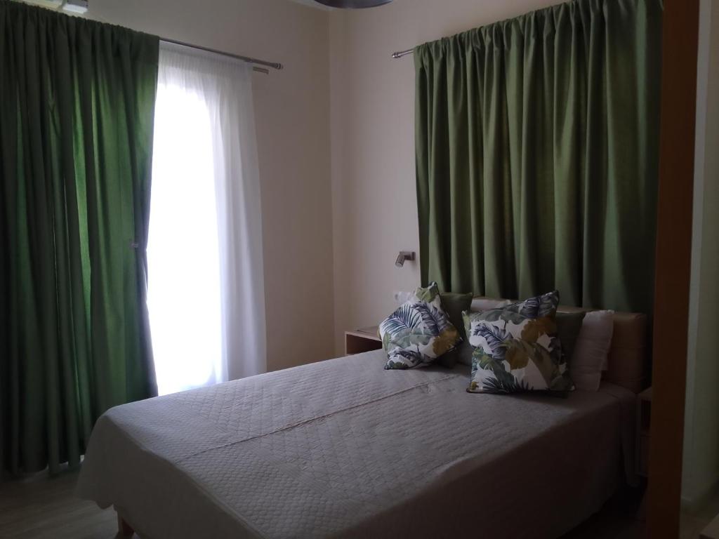 A bed or beds in a room at Eleonas Holiday Home Apartment