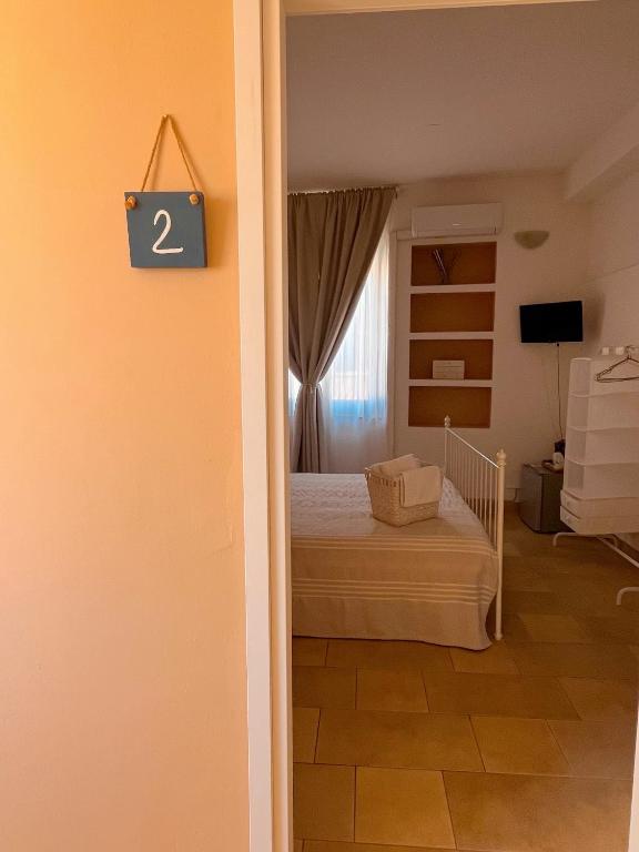 Postel nebo postele na pokoji v ubytování Regina Margherita B&B