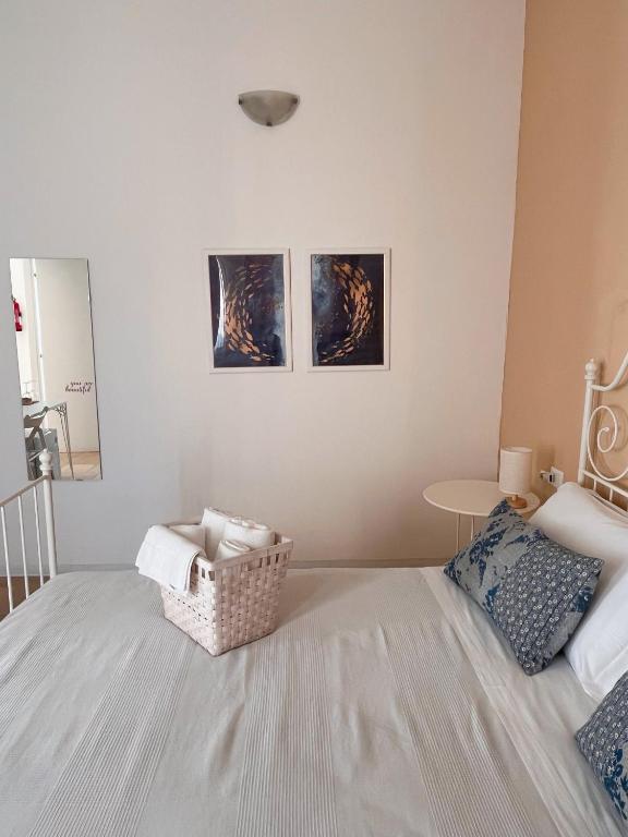 Postel nebo postele na pokoji v ubytování Regina Margherita B&B