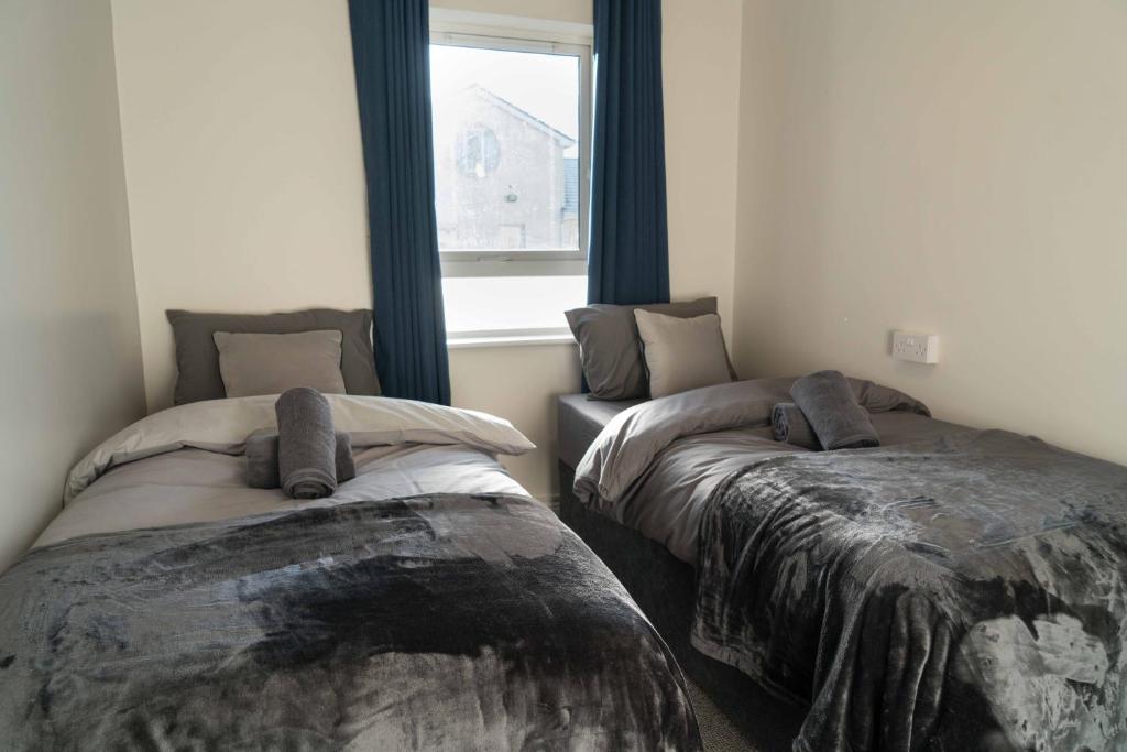 Postel nebo postele na pokoji v ubytování Glancys Accomadation