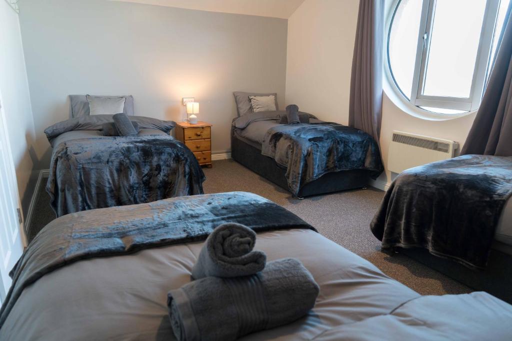 Postel nebo postele na pokoji v ubytování Glancys Accomadation