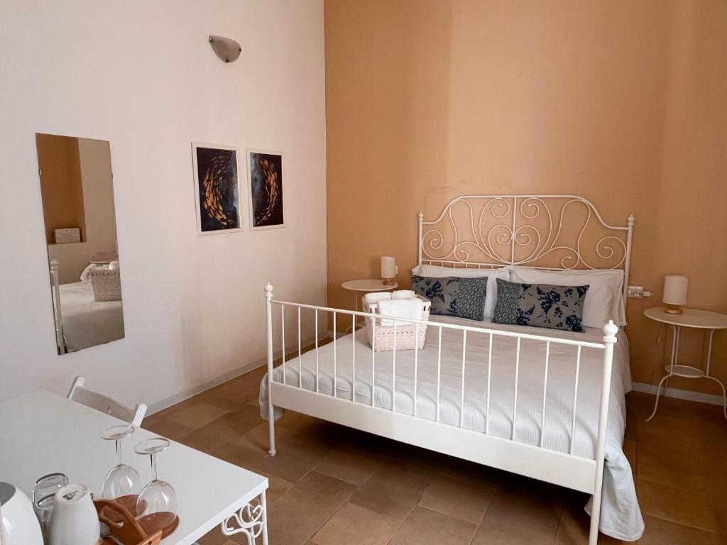 Postel nebo postele na pokoji v ubytování Regina Margherita B&B