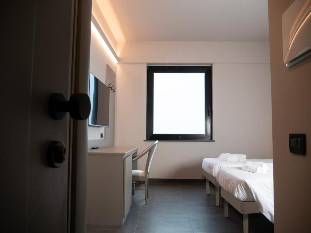 Postel nebo postele na pokoji v ubytování Aldero Hotel