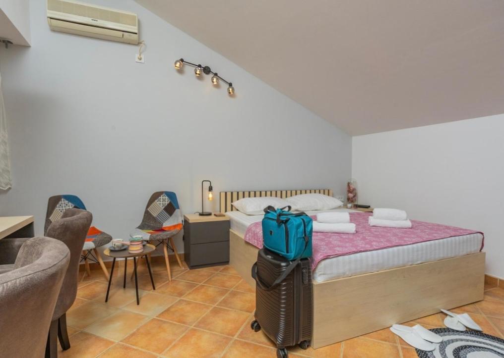 Ліжко або ліжка в номері Adzic Apartments