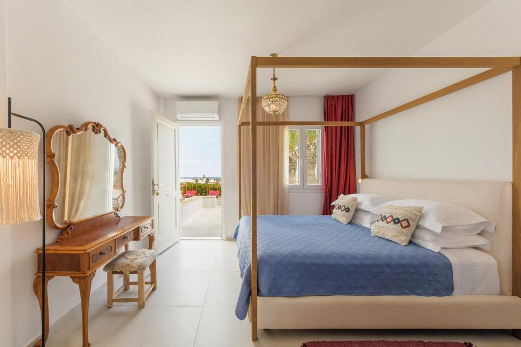 Postel nebo postele na pokoji v ubytování Kallisti Paros