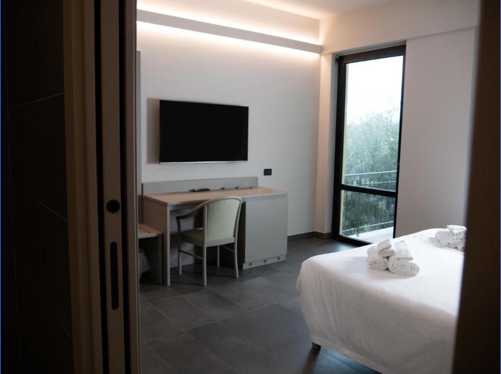 TV a/nebo společenská místnost v ubytování Aldero Hotel
