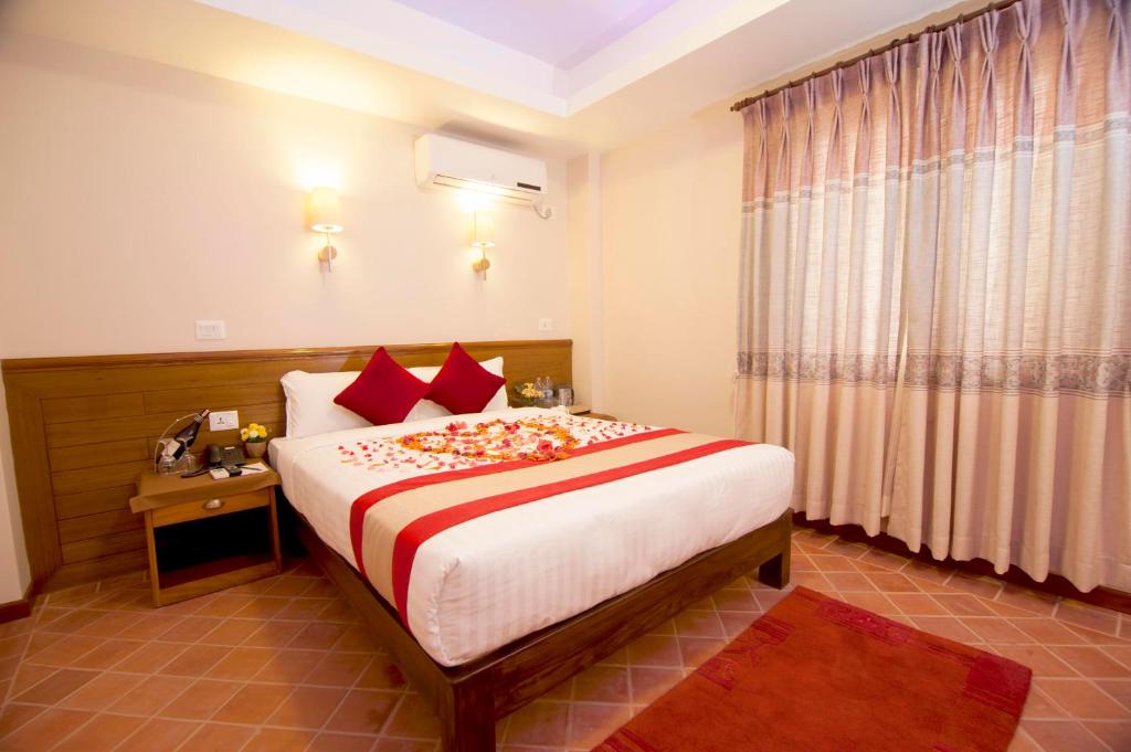 Postel nebo postele na pokoji v ubytování Hotel Utsab Himalaya