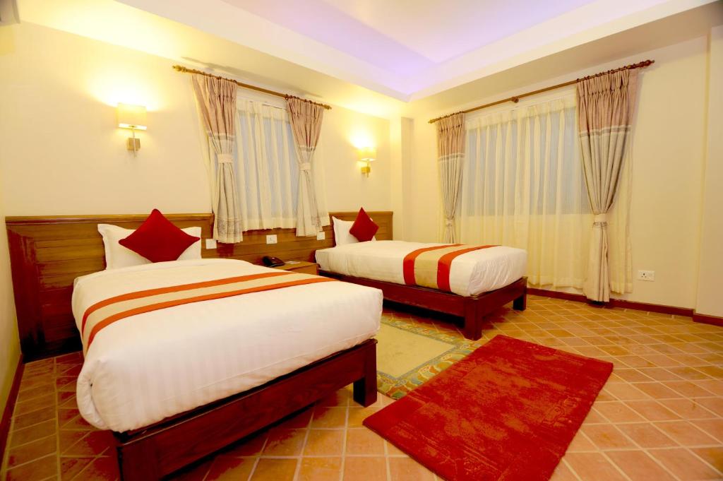 Postel nebo postele na pokoji v ubytování Hotel Utsab Himalaya