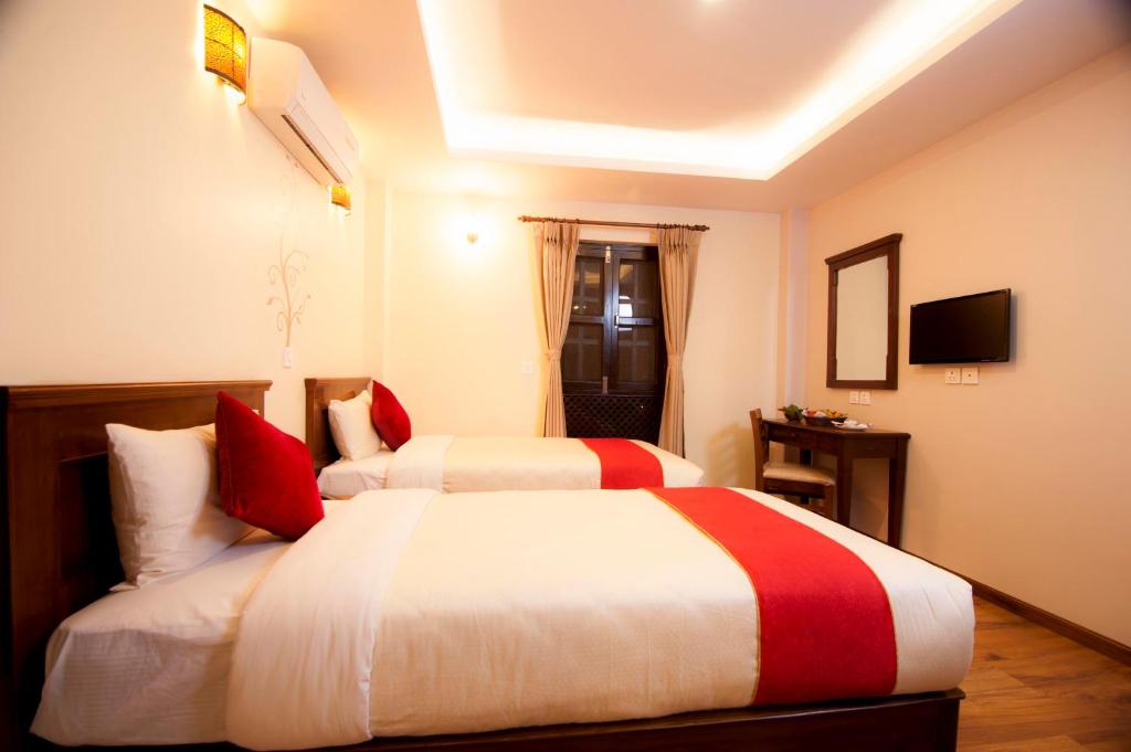 Postel nebo postele na pokoji v ubytování Hotel Utsab Himalaya
