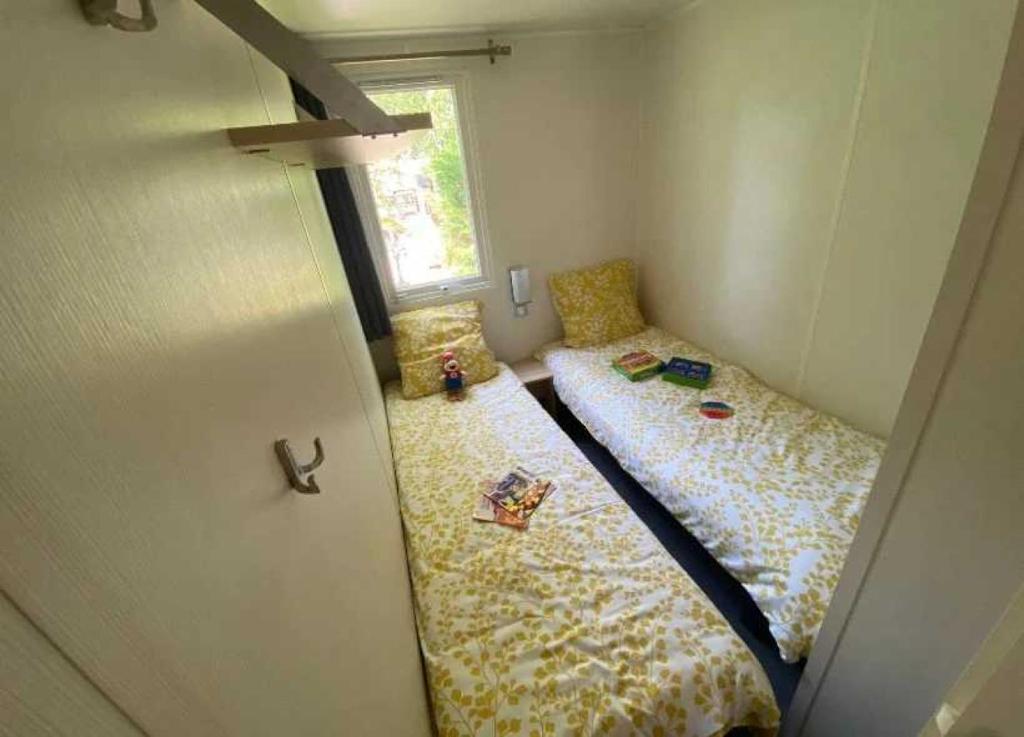 Postel nebo postele na pokoji v ubytování Camping - Piscine - ccaghc0