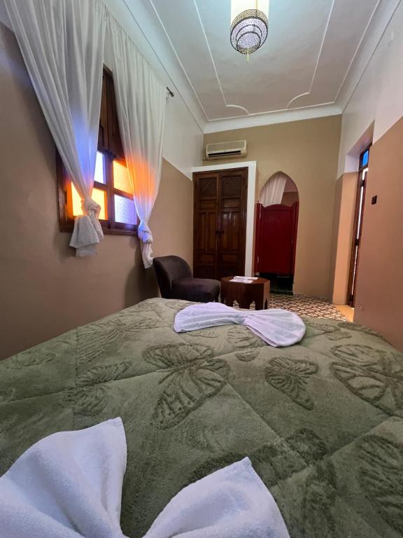 Postel nebo postele na pokoji v ubytování Riad La Perla Bianca
