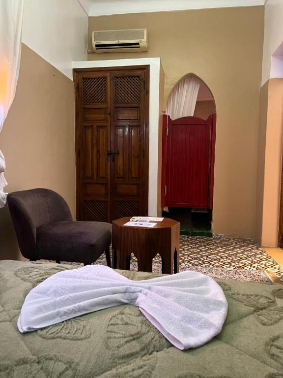 Postel nebo postele na pokoji v ubytování Riad La Perla Bianca