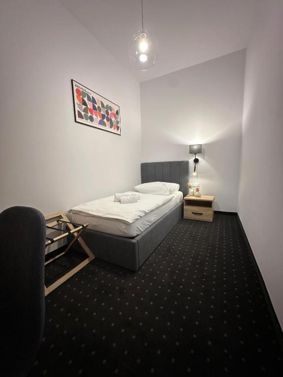 Postel nebo postele na pokoji v ubytování Hotel Portus