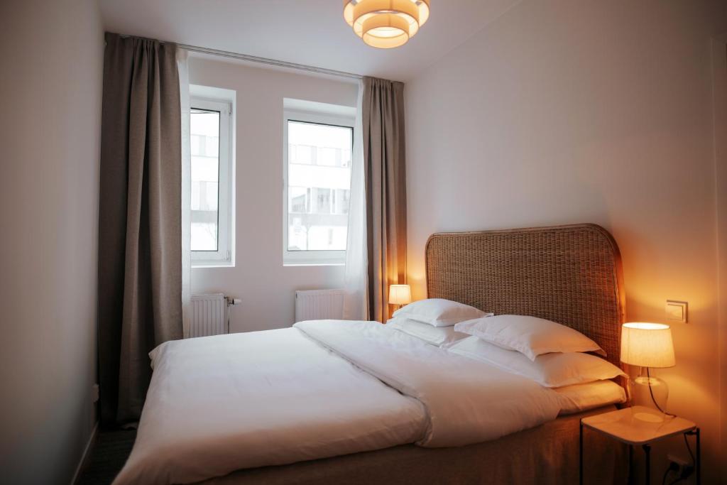Postel nebo postele na pokoji v ubytování The Lab Hotel