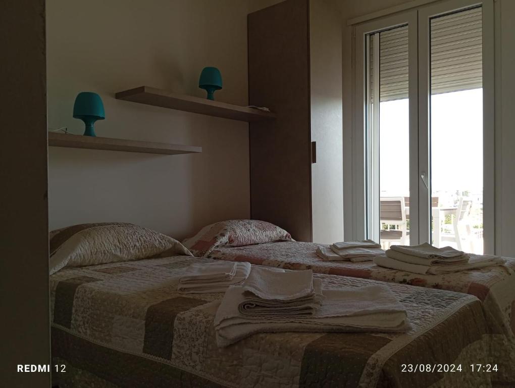 Postel nebo postele na pokoji v ubytování Casa mare Torre Pali Salento