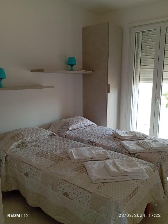 Postel nebo postele na pokoji v ubytování Casa mare Torre Pali Salento